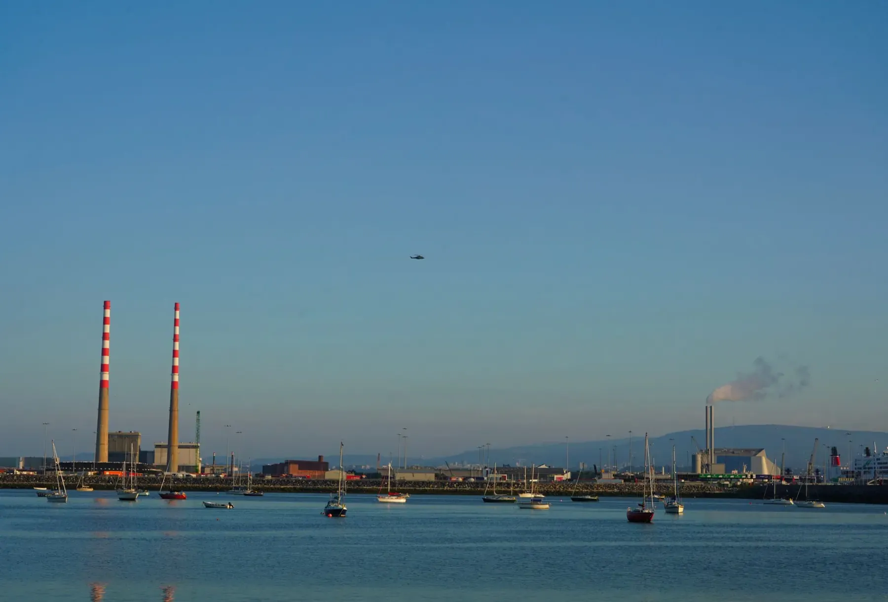 Dublin Bay at daybreak, with the Poolbeg chimneys at the mouth of Dublin Port