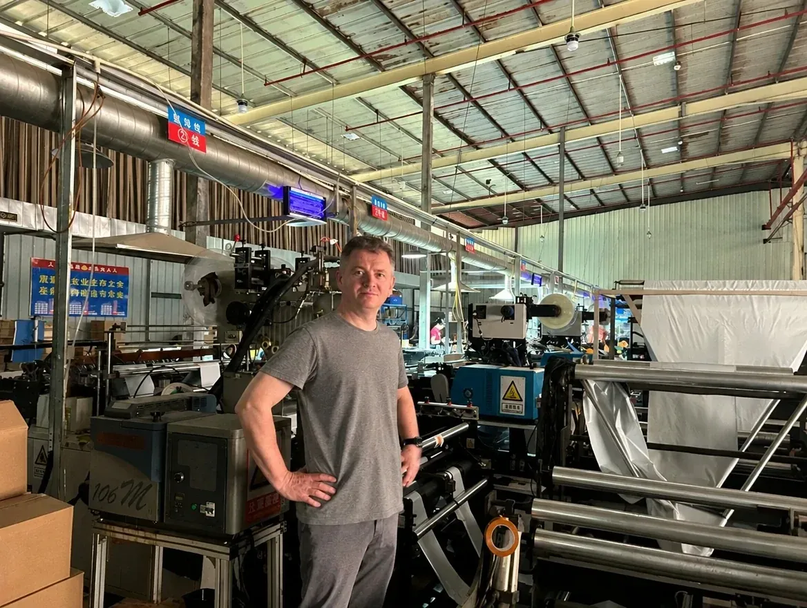 Noel Murphy at a production line in a packaging factory in China