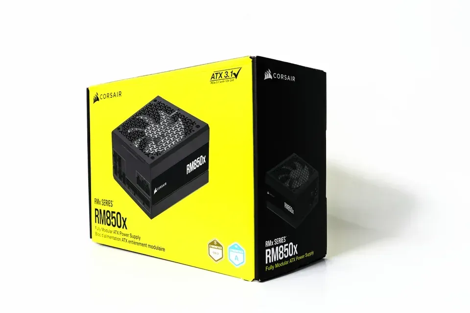 A Corsair RM850x power supply box in yellow and black