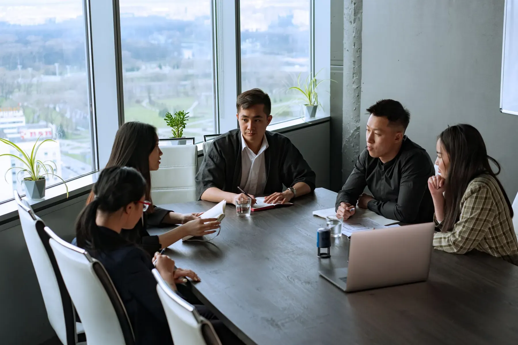 A team meeting around a table in an office
